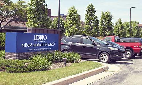 cars in the Carroll University Center for Graduate Studies parking lot